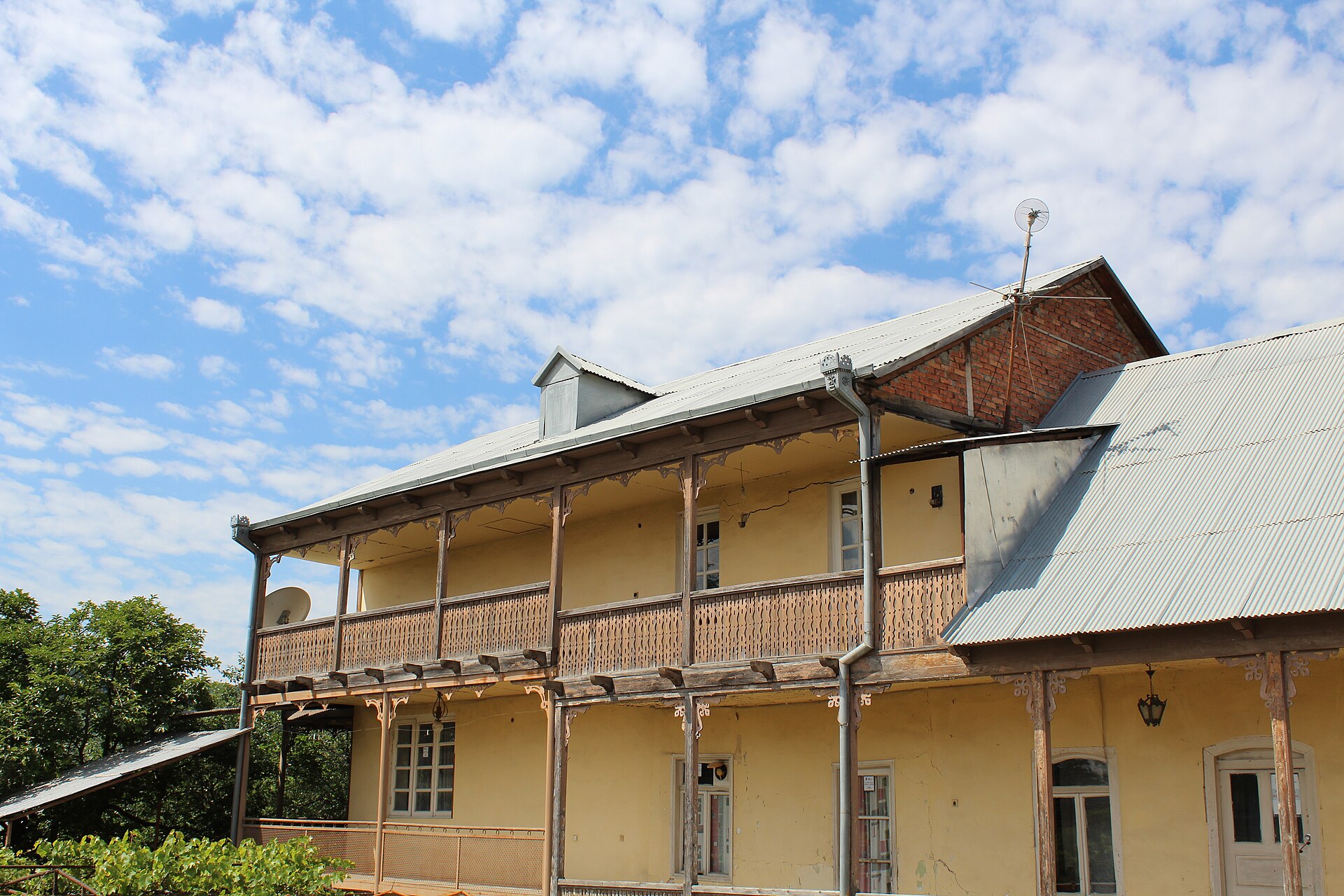 Historic house in Bolnisi's German district with a long wooden balcony