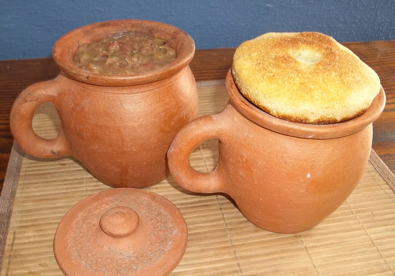 Georgian bean stew in clay pots with cornbread