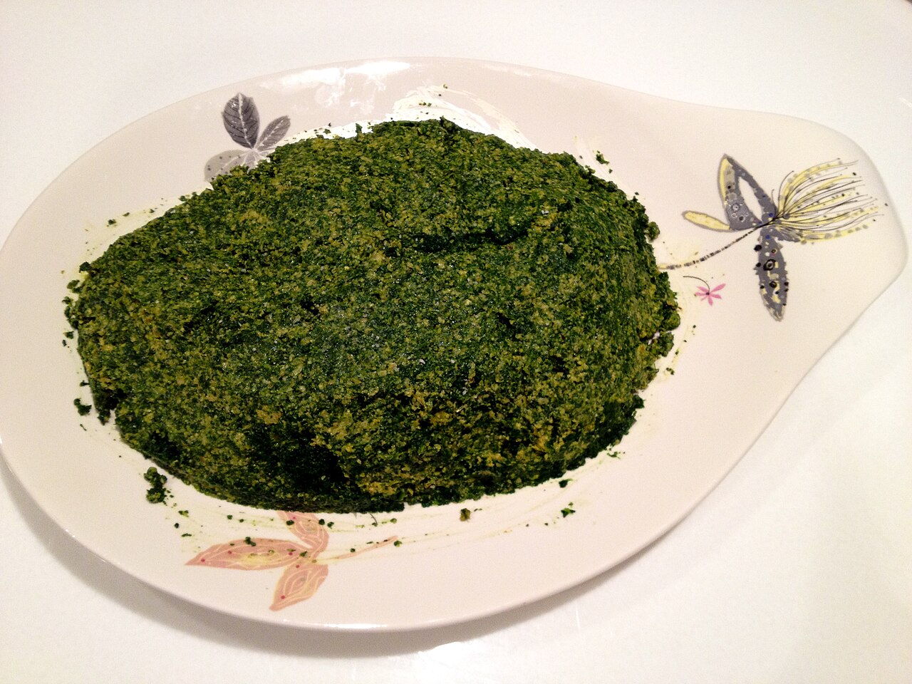 Spinach and walnut pkhali served on a plate