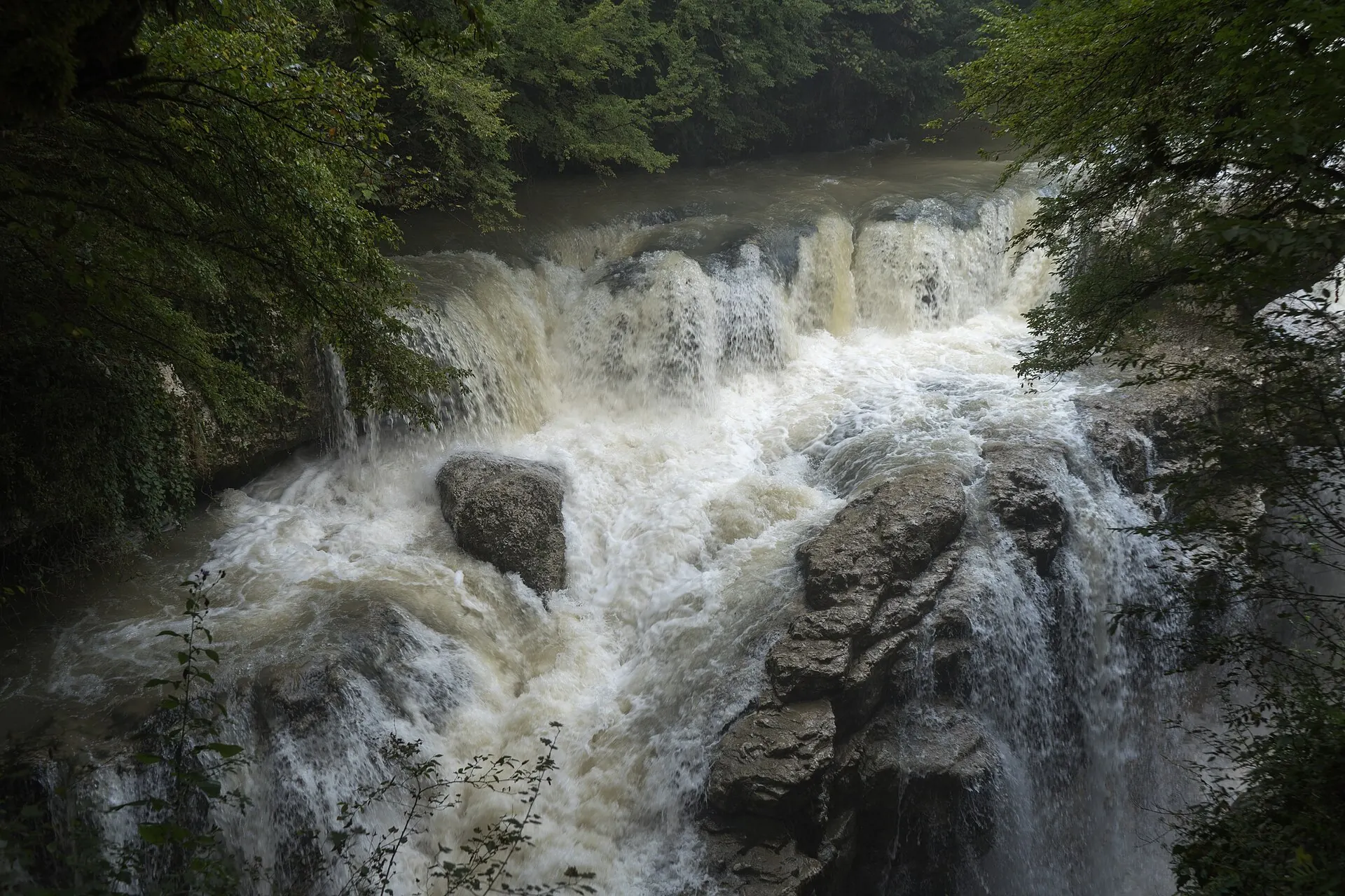 Water spilling over a rocky ledge at Martvili Canyon