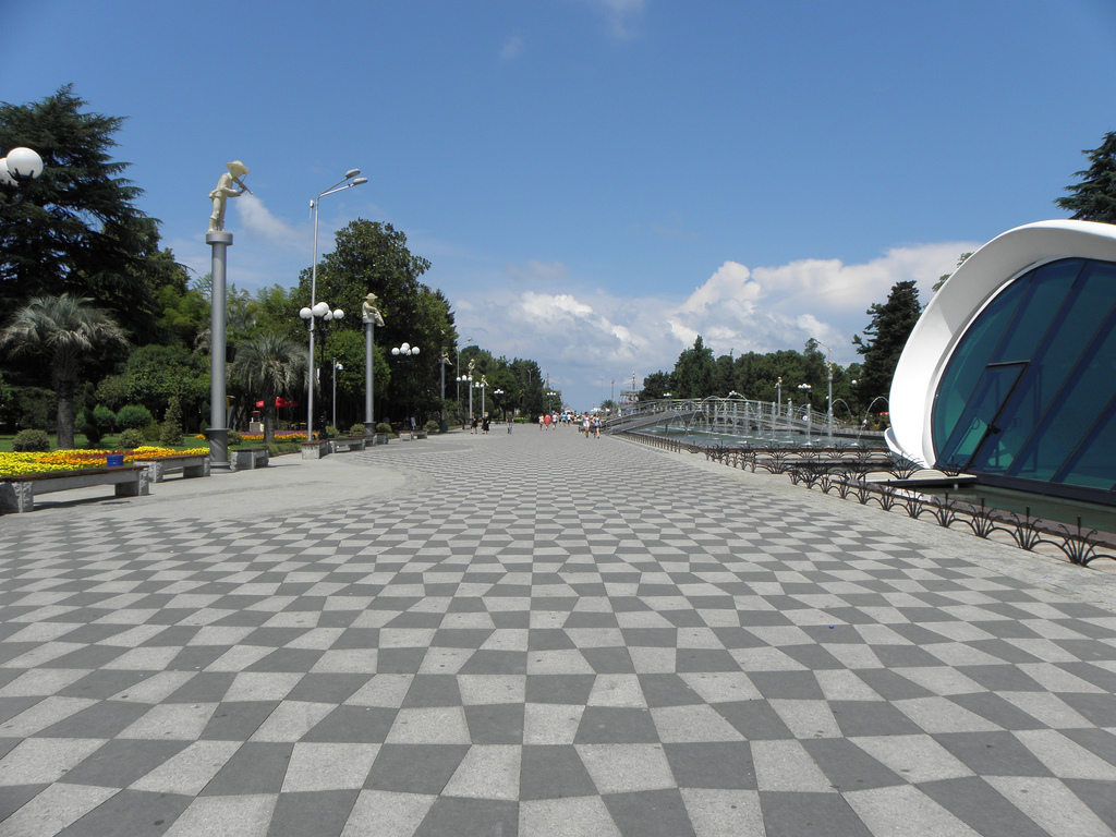 Wide tiled promenade with trees and fountains on Batumi Boulevard