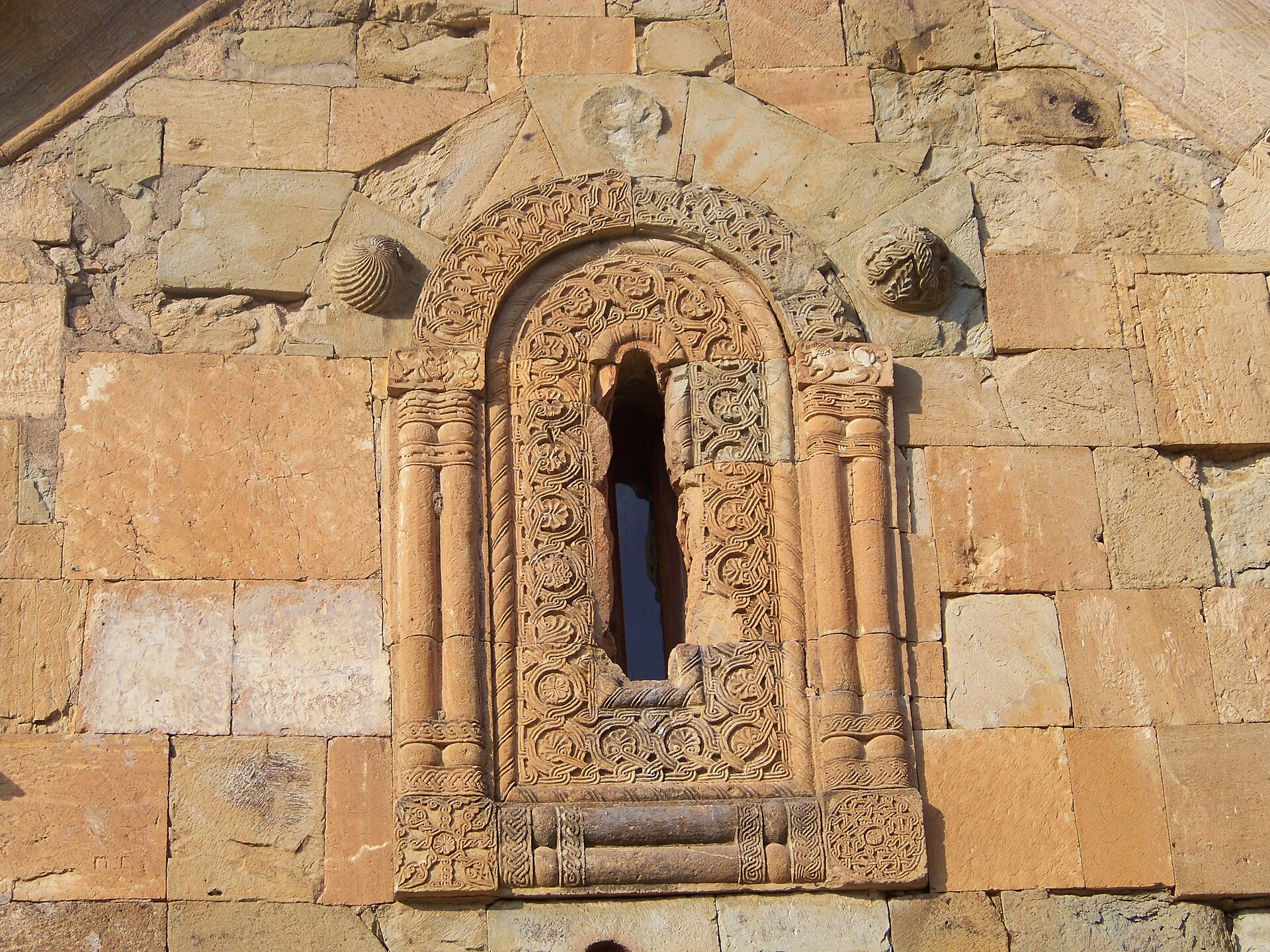 Intricately carved window on Tsughrughasheni Church