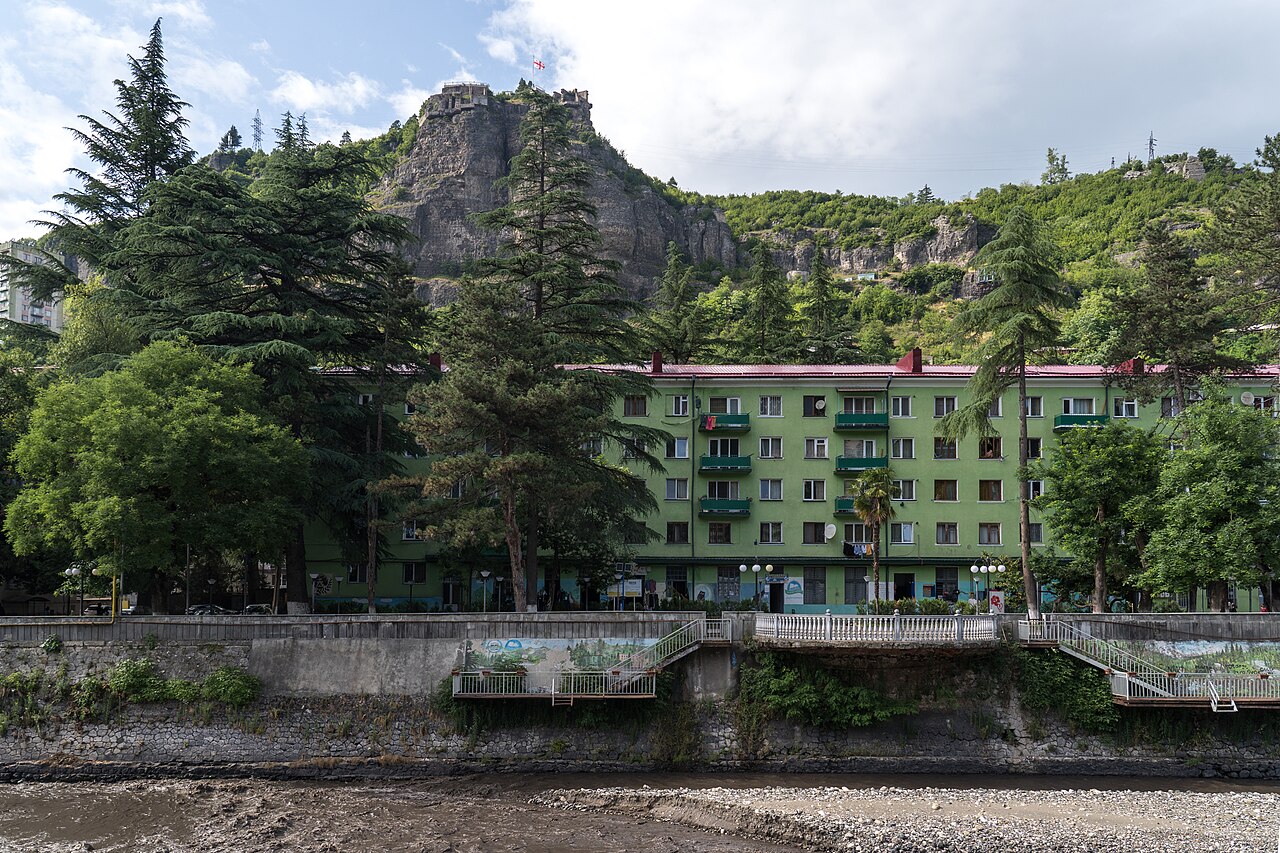 Chiatura buildings beside the Kvirila River, shown as town context for the museum visit