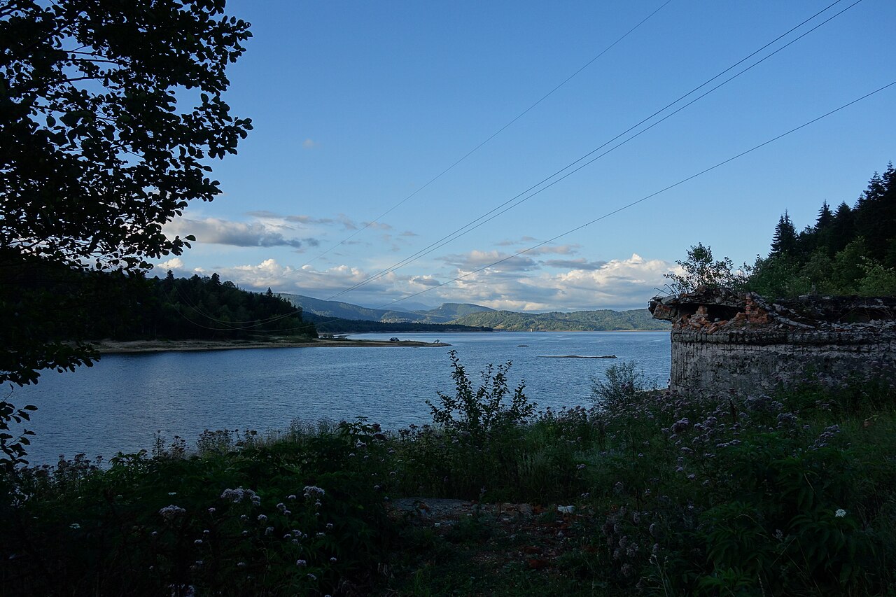 Shaori Reservoir among wooded hills in Racha